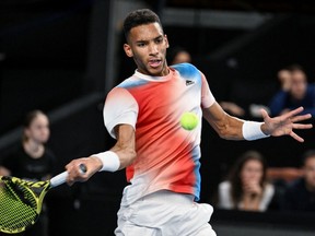 Montrealer Félix Auger-Aliassime returns the ball during his semifinal match against Roman Safiullin of Russiaat the ATP Open 13 in Marseille, France, on Saturday, Feb. 19, 2022.