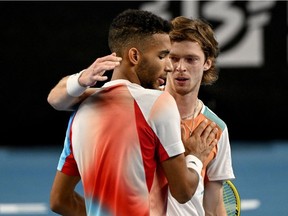 Andrey Rublev of Russia, right, greets Montrealer Félix Auger-Aliassime after winning their final tennis match at the ATP Open 13 in Marseille, France, on Sunday, Feb. 20, 2022.