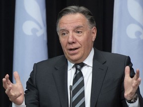 Quebec Premier François Legault responds to reporters during a news conference on the COVID-19 pandemic, Tuesday, February 1, 2022 at the legislature in Quebec City.