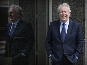 Former Quebec premier Jean Charest outside the building where he works at McCarthy Tetrault law firm in 2021.