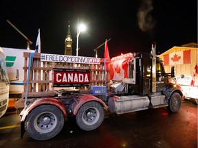 A truck that is part of a convoy to protest COVID-19 mandates is seen on Parliament Hill in Ottawa on January 28, 2022.