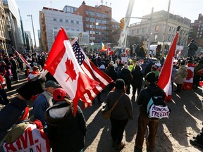 Truckers and supporters attend a demonstration near Parliament Hill as they continue to protest against COVID-19 vaccine mandates, in Ottawa on January 31, 2022.