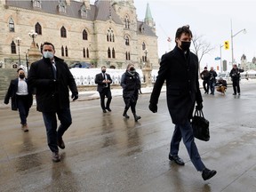 Prime Minister Justin Trudeau walks to a news conference after police ended a three-week occupation of Ottawa, February 21, 2022.