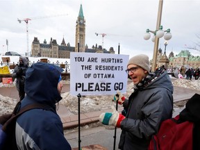 A counter-protester speaks as truckers and their supporters continue to protest COVID-19 restrictions and mandates in Ottawa, February 10, 2022.