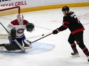 Senators' Brady Tkachuk (7) is unable to tip the puck against Canadiens goaltender Andrew Hammond during third period NHL hockey action in Ottawa on Saturday, Feb. 26, 2022.