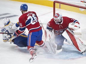 Canadiens goaltender Sam Montembeault is scored on by Buffalo Sabres' Jeff Skinner (53) as Canadiens' Jeff Petry defends during third period NHL hockey action in Montreal on Sunday, Feb. 13, 2022.