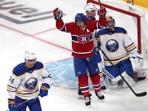 Canadiens' Brendan Gallagher (11) celebrates Mike Hoffman's (not pictured) goal against Buffalo Sabres goaltender Craig Anderson during the second period at the Bell Centre on Sunday, Feb. 13, 2022, in Montreal.