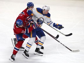 Buffalo Sabres' Jeff Skinner (53) and Canadiens' Josh Anderson (17) collide during the third period at the Bell Centre on Sunday, Feb. 13, 2022, in Montreal. Skinner had a five-point outing against the Canadiens with four goals and an assist.