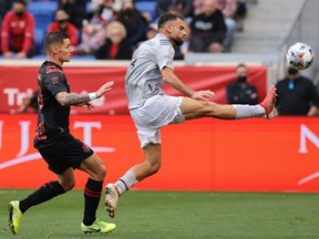 CF Montréal defender Rudy Camacho plays the ball ahead of New York Red Bulls forward Patryk Klimala during the first half at Red Bull Arena in Harrison, N.J., on Oct. 30, 2021.