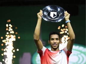 Felix Auger-Aliassime poses with the trophy as he celebrates after winning the final against Greece's Stefanos Tsitsipas REUTERS/Piroschka Van De Wouw