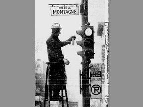 Stop lights are cleaned in Montreal in 1972.
