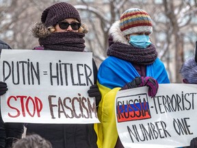 People rally at Place du Canada in Montreal on Sunday, Feb. 27, 2022, to decry the Russian invasion of Ukraine.