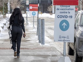 A woman leaves a COVID-19 vaccination clinic in the St-Laurent borough of Montreal last month.