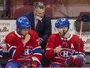 Montreal Canadiens interim head coach Martin St. Louis has a conversation with Jake Evans, left, and Paul Byron during third period against the Washington Capitals in Montreal on Feb. 10, 2022. 