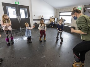 Lara Munro leads Emma and Alice McSweeny, left and Mikayla Larouche and Chloe Syvrett, right, through her Grooving With Miss Lara exercise class at the Shannon Park chalet in Beaconsfield, on Tuesday.