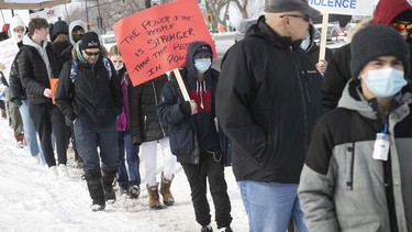 A march in honour of Lucas Gaudet makes its way along Park Ave. on Saturday, March 5, 2022, to denounce violent crimes toward kids and young adults. Lucas Gaudet was 16 when he was stabbed to death in February.