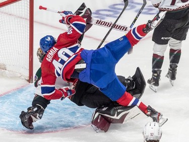 Montreal Canadiens right wing Joel Armia (40) collides with Arizona Coyotes goaltender Karel Vejmelka (70) during 1st period NHL action at the Bell Centre in Montreal on Tuesday, March 15, 2022.