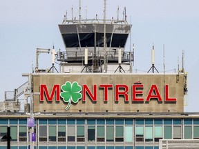 A shamrock replaces the O on the sign atop the terminal at Montréal–Trudeau International Airport in 2021.