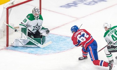 Dallas Stars goaltender Jake Oettinger (29) makes the save on Montreal Canadiens left wing Artturi Lehkonen (62) during 1st period NHL action at the Bell Centre in Montreal on Thursday, March 17, 2022.