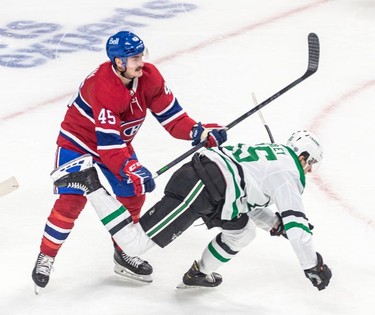 Montreal Canadiens centre Laurent Dauphin (45) received two minutes for interference against Dallas Stars defenseman Thomas Harley (55) during 1st period NHL action at the Bell Centre in Montreal on Thursday March 17, 2022.