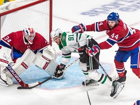 Canadiens defenceman Joel Edmundson received a cross-checking penalty after clearing Stars' Tyler Seguin from in front of Canadiens goaltender Jake Allen Thursday night at the Bell Centre.