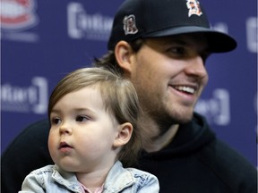 Former Montreal Canadiens defenceman Ben Chiarot speaks to the media with his daughter, Emmerson, during a news conference in Montreal on Thursday, March 17, 2022.