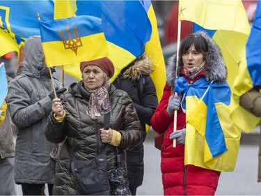 Women sing a Ukrainian hymn prior to a march through downtown Montreal on Saturday, March 19, 2022, in support of Ukraine and to denounce Russia and Vladimir Putin.