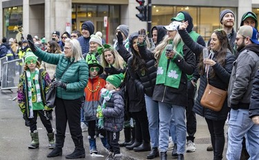 St. Patrick's parade revellers at the corner of Peel and St-Catherine St. in Montreal on March 20, 2022.