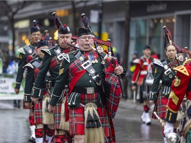 Bagpipers from the Regimental Pipes and Drums of the Black Watch (RHR) of Canada perform in Montreal's St. Patrick's parade March 20, 2022.