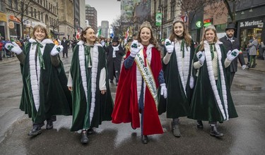 St. Patrick's Day Parade Queen Orla Mahon with princesses, from left, Meg Sweeney, Rebecca McAuley, Julia Barnwell and Aveen Mahon, walk down St-Catherine St. during the parade in Montreal on March 20, 2022.