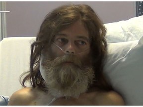 Raymond Henry Muller is seen in a 2018 video recording while he was interrogated from his hospital bed.