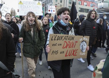 University and CEGEP students and supporters from across Quebec took part in a demonstration/march on Tuesday, March 22, 2022 in Montreal starting at Place du Canada, to demand free tuition. This was on the 10th anniversary of the Maple Spring student protests.