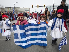 Young members of the the Hellenic Community of Greater Montreal march along Jean Talon St. during the Greek Independence Day parade in 2019.