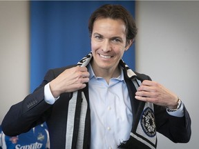 Newly appointed CF Montréal president Gabriel Gervais, with a club scarf on Tuesday March 29, 2022.