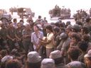 Leonard Cohen performs for Israeli troops in the Sinai in October 1973, flanked by future Prime Minister Ariel Sharon, left, and Israeli musician Matti Caspi.