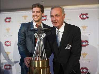 MONTREAL, QUE.: MAY 27, 2015 -- Former Montreal Canadiens great Guy Lafleur (right) poses with Olivier Hinse of the Concordia Stingers who received a Guy Lafleur Award of Excellence in Montreal Wednesday, May 27, 2015. Three other players received awards that are given to players from the Quebec Major Junior Hockey League, Canadian Interuniversity Sport, the Quebec Junior Hockey League and the Collegiate Men's Hockey League who have best combined hockey performances and scholastic achievements.