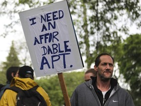 Richard Dow takes part in a protest led by Front d'action populaire en réaménagement urbain (FRAPRU) in 2019.
