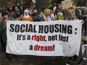 People take part in a protest led by Front d'action populaire en réaménagement urbain (FRAPRU) in 2019.