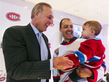 MONTREAL, QUE.: OCTOBER 16, 2014 -- Montreal Canadiens legend Guy Lafleur greets Habs fans Michael Palmer and his son Logan at tailgate outside the Bell Centre prior to the Habs home opener in Montreal Thurssday October 16, 2014.  The Palmers are from Toronto.