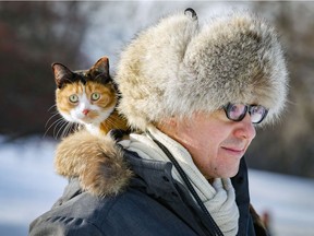 Antonino Medina takes his cat La Chickita for a walk on Mount Royal in November.