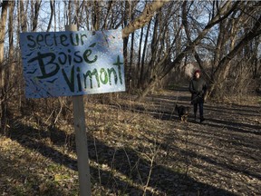 Cassandre Charbonneau-Jobin with her dog Mishka in a wooded area beside an industrial piece of land in Hochelaga-Maisonneuve on Tuesday, December 14, 2021. The land was abandoned for so long residents adopted it as a much-needed park.