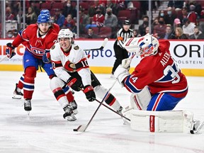 Canadiens goaltender Jake Allen skates out from his net to play the puck away from Alex Formenton (10) of the Ottawa Senators during the third period at the Bell Centre on Saturday, March 19, 2022, in Montreal.