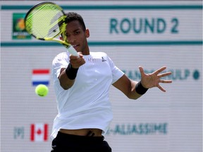 Montreal's Félix Auger-Aliassime returns a forehand in his match against Botic Van De Zandschulp of the Netherlands during the BNP Paribas Open at the Indian Wells Tennis Garden on Sunday, March 13, 2022, in Indian Wells, Calif.