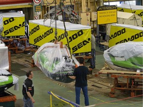 BRP employees wrap and package Sea-Doos on a Sea-Doo assembly line at the BRP plant in Valcourt on June 12, 2014.