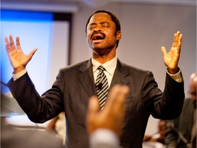 Rev. Mwinda Lezoka gives a fiery sermon at Actions Bethel du Canada church in Montreal on Sunday, Aug. 1, 2010.