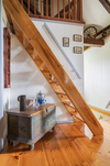The miller staircase leading to the attic was installed at a steep angle to save space.