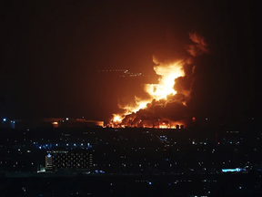 An Aramco oil depot close to the circuit is seen in flames following an incident during practice ahead of the F1 Grand Prix of Saudi Arabia at the Jeddah Corniche Circuit on Friday, March 25, 2022, in Jeddah, Saudi Arabia.