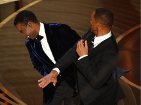 Will Smith (R) slaps actor Chris Rock onstage during the 94th Oscars at the Dolby Theatre in Hollywood, California on March 27, 2022. The crowd’s positive reaction when Smith picked up a statuette for best actor, less than an hour after the attack was disturbing, Martine St-Victor says.