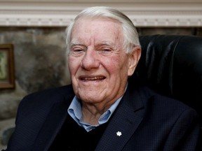 Dick Irvin wears the lapel pin at his home in Pointe-Claire on Jan. 2, 2014, after being named a Member of the Order of Canada.