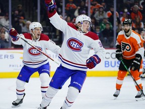 Canadiens' Rem Pitlick, centre, celebrates after scoring a goal during the third period against the Flyers on Sunday, March 13, 2022, in Philadelphia.